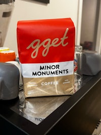 a bag of coffee sits on top of a table