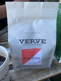 a bag of verve coffee sits on a table next to a cup of coffee